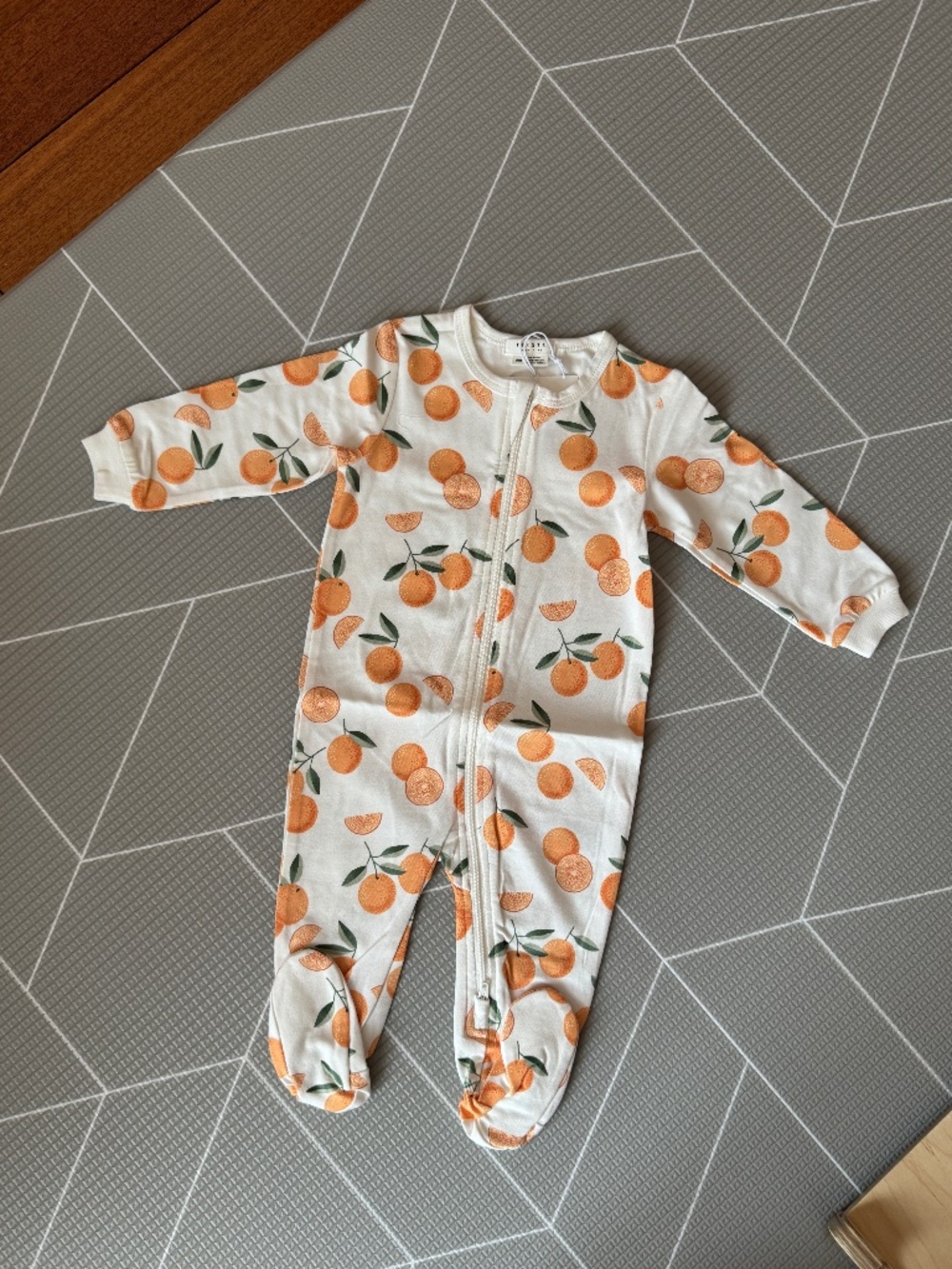 Petit lem orange patterned pajamas for baby